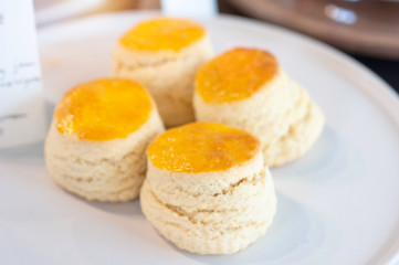 Butter scone in white plate for tea break, favorite bakery.