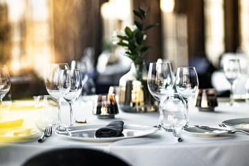 Beautiful table set for an event party or wedding reception . restaurant interior	