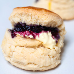 Butter scone with premium buttr and blueberry jam, tea break with butter scones.