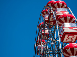 Amusement ride against blue sky. Skydiver (Ferris wheel) in a amusement park in Bucharest .