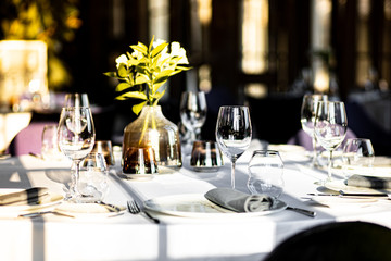 Beautiful table set for an event party or wedding reception . restaurant interior	