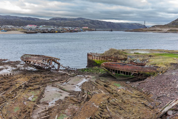 Cemetery of old ships in Teriberka Murmansk Russia, dramatic photo. Aerial top view.