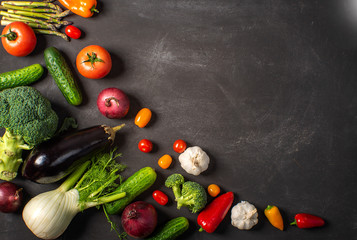 Exposition of fresh organic vegetables on black table. tomato, pepper, broccoli, onion, garlic, cucumber,  eggplant, black Eyed Peas, ecological bag.