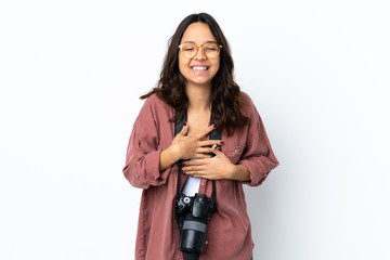 Young photographer woman over isolated white background smiling a lot
