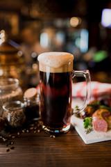 Dark beer in bar bokeh