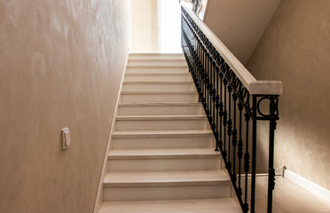 Classic wooden stairs in a stylish house. Knots for connecting stair parts