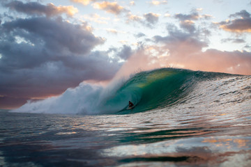 Surfer riding a big tubing wave