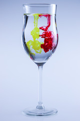 Food color, red and yellow. Drop splash in water.