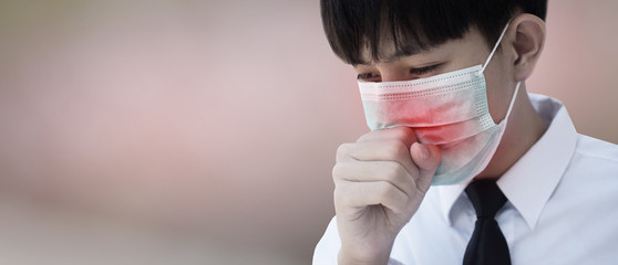 A man wearing surgical mask to cover his nose With coughing and sneezing Due to illness In order to prevent the spread of viruses and germs to others,face mask protect corona virus 2019