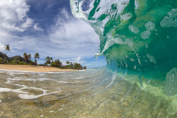 wave breaking on a tropical island