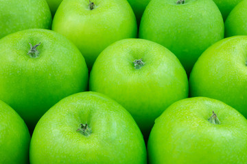 Many green apples as background