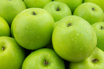 Green apples with water drops