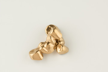 Artificial tooth crown coated gold