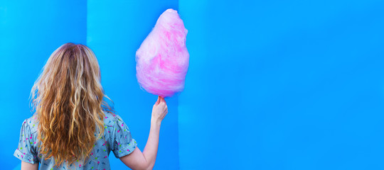 girl or woman with cotton candy and copy space