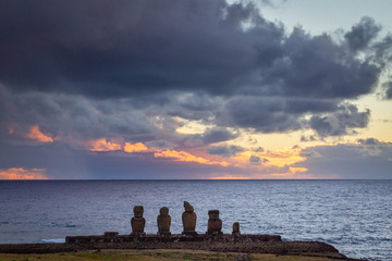 Moai statues at dusk on easter island, rapa nui