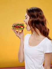 young woman eating pizza