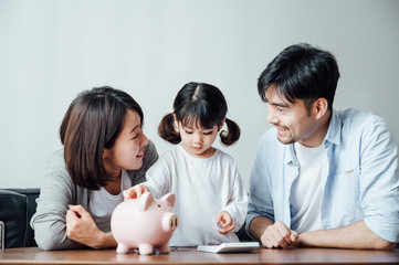Mom and Dad and daughter at home, the number of coins