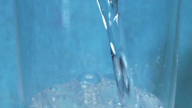 A Glass Of Clean Drinking Soda Water From Above On A Blue Background