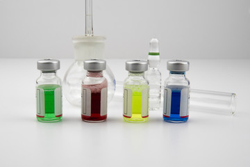 Glass vials containing coloured solutions as a medical treatment for the pharmaceutical industry