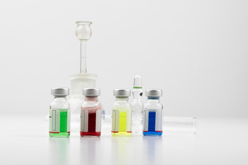Glass vials containing coloured solutions as a medical treatment for the pharmaceutical industry