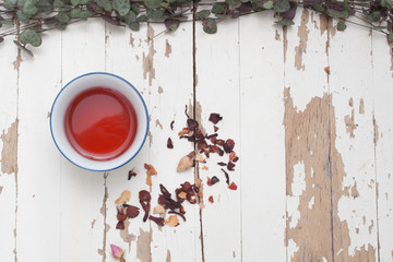 A high view of Rosehip Tisane in a cup with loose leaves