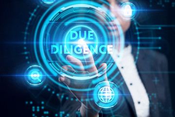Business, Technology, Internet and network concept. Young businessman working on a virtual screen of the future and sees the inscription: Due diligence