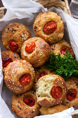 Muffins with cheese, cottage cheese and tomatoes, vegetables and cheese served with wine.