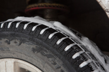 Studded tires in winter, snow in the tire on the winter road