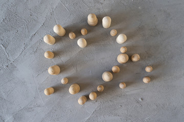 Many groups of wooden figures of people communicate stand in a on a gray concrete.  Flat lay. Concept