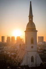 Fototapeta na wymiar Cityscape of Bratislava at dawn with St. Martin's Cathedral in front, Slovakia