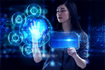 Business, Technology, Internet and network concept. Young businessman working on a virtual screen of the future and sees the inscription: Transformation
