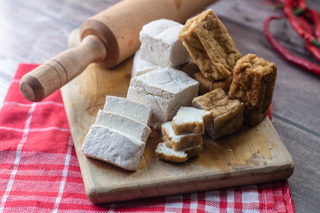 fresh white tofu on wooden table