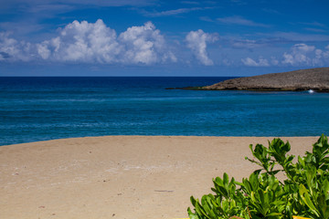 tropical beach with blue sky and clouds