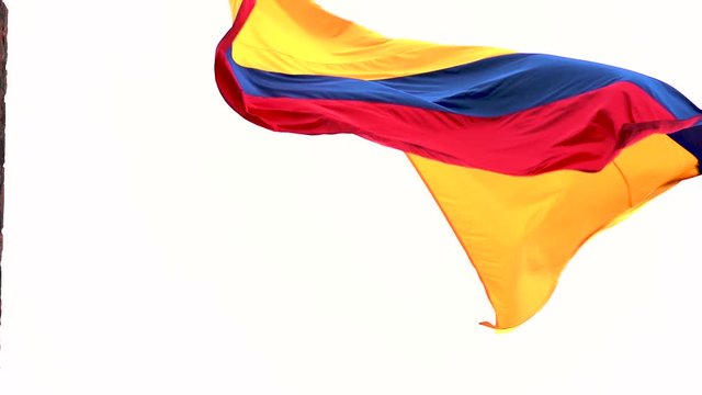 Colombia national flag waving in the wind over San Felipe Castle in Cartagena. Footage in slow motion from underneath.