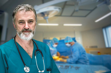 Portrait of a gray-haired doctor in the operating room
