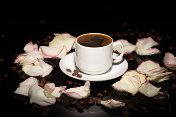 Cup with coffee beans on a dark background