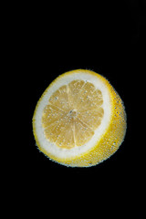 lemon slice on black