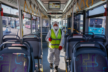A worker of Istanbul Metropolitan Municipality disinfects the local buses to prevent the spread of the COVID-19, the novel coronavirus.