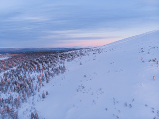 Charming winter sunset in Lapland