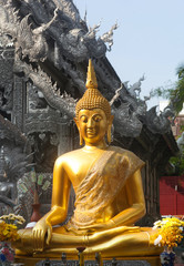 Obraz premium Golden statue of Buddha at the Wat Sri Suphan, or Silver temple in Chiang Mai, Northern Thailand