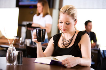 Coffee: Pretty Woman Reading Book And Having Coffee