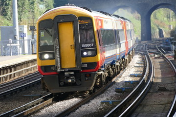 Fototapeta premium express train passing railway station at high speed