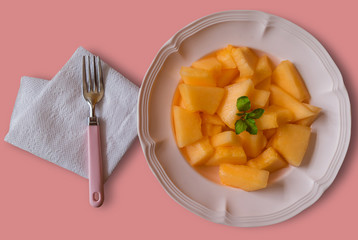 fresh melon slices ready to eat on the table.