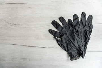 Anti virus protection mask and gloves on the wooden table