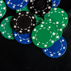 green black and blue poker chips
