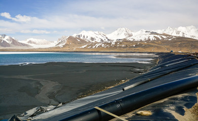 artificial lake, waste ore and mountains at an altitude of 3800 meters above sea level