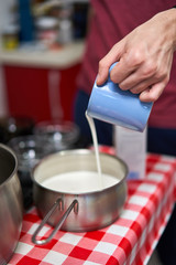 Man pouring milk