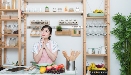 Happy asian woman looking recipe tablet kitchen reading cooking at home,University colleague student study online with social media,Social distancing, stay at home and work from home concept.