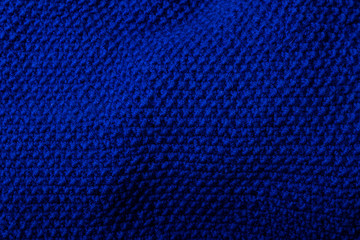 blue handknitted fabric texture. abstract handmade background