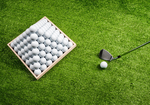 Pyramid Of Golf Balls, Golf Ball And Golf Club In A Driving Range, Top View